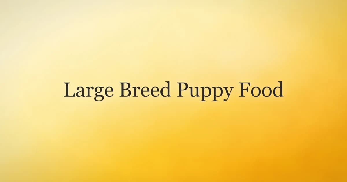 A large breed puppy sitting beside a food bowl, illustrating feeding large breed puppies correctly